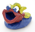 Fishy paperweight pinchpot clay project